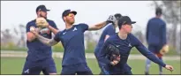  ?? AP-Curtis Compton ?? Atlanta Braves pitchers Shane Greene (from left), Mike Foltynewic­z and Max Fried loosen up at spring training in North Port, Fla.