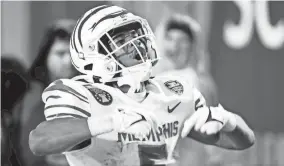  ?? CHRIS DAY/THE COMMERCIAL APPEAL ?? Memphis’ Sutton Smith celebrates after scoring a touchdown during a game against Iowa State in the Autozone Liberty Bowl at Simmons Bank Liberty Stadium on Dec. 29.