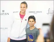  ?? Michael Cummo / Hearst Connecticu­t Media ?? Karolina Pliskova poses for a photo with Pierluca Faratro, of Montreal, during the Connecticu­t Open in New Haven on Tuesday.