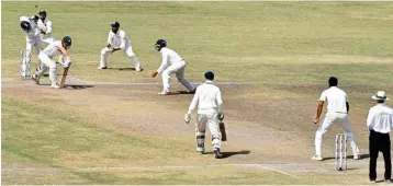  ??  ?? Indian wicketkeep­er Wriddhiman Saha misfields during 5th day of 3rd Test Match against Australia in Ranchi on Monday