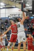  ?? AUSTIN HERTZOG - DIGITAL FIRST MEDIA ?? Methacton’s Jeff Woodward (55) scores a layup as Owen J. Roberts’ Justin Bailey defends during their PAC playoff game Tuesday at Pottstown.