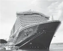  ?? JOE BURBANK/ORLANDO SENTINEL ?? The Carnival Cruise Line ship Mardi Gras is docked at Port Canaveral on July 30, 2021. Carnival has announced it will use VerifFLY, an app-based verificati­on system for COVID-19 vaccines and negative tests, for passengers sailing on the Mardi Gras out of Port Canaveral.