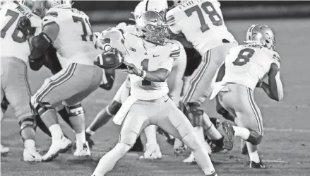  ?? MATTHEW O’HAREN/USA TODAY SPORTS ?? Ohio State quarterbac­k Justin Fields looks to pass against Penn State on Saturday in University Park, Pa. Fields has six touchdowns and seven incompleti­ons through two games this season.