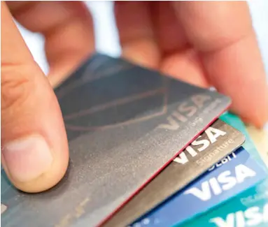 ?? Associated Press ?? ABOVE: Visa credit cards are seen in New Orleans. If you’ve been denied COVID-19 assistance for your credit cards or offered terms that are not sustainabl­e, credit counseling may get your finances on
track.