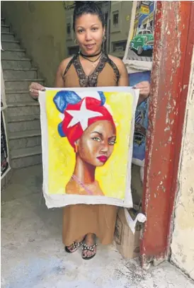  ?? MARY MITCHELL/SUN-TIMES PHOTOS ?? A vendor in Cuba’s Old Havana.