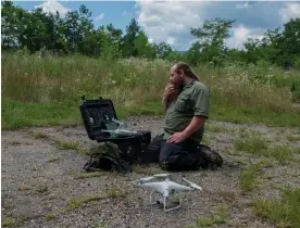  ?? Photograph: Roger May/The Guardian ?? Junior Walk, of Coal River Mountain Watch in Naoma, West Virginia, prepares his drone to fly near a reclaimed surface mine in Edwight.