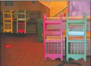  ??  ?? Colorful chairs are flipped over on dining tables at a Mexican restaurant on Olvera Street in Los Angeles.