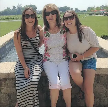  ??  ?? Kristen Dulysh, left, sits with her mother Cindy and sister Nicole. Cindy died of cancer last year.