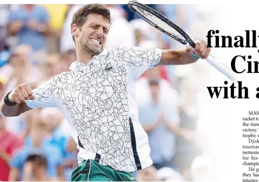  ??  ?? Novak Djokovic of Serbia gets a high after his win over Roger Federer of Switzerlan­d during the men’s final of the Western &amp; Southern Open at Lindner Family Tennis Center in Mason, Ohio. AFP