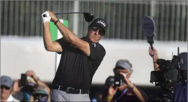  ?? JOHN PENDYGRAFT — THE ASSOCIATED PRESS ?? Phil Mickelson tees off on the first day of the PGA Valspar Championsh­ip golf tournament in Palm Harbor, Fla., April 29.