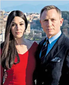  ??  ?? In the swim: Daniel Craig, pictured with
Spectre co-star Monica Bellucci, will play 007 again