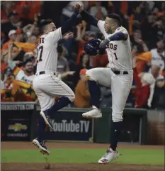  ??  ?? Houston Astros’ Carlos Correa celebrates his two-run home run with Jose Altuve during the seventh inning of Game 5 of baseball’s World Series against the Los Angeles Dodgers on Sunday in Houston. AP PHOTO/DAVID J. PHILLIP