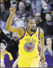  ?? Marcio Jose Sanchez The Associated Press ?? Warriors forward Kevin Durant celebrates Saturday after scoring in the first half of Golden State’s 120-80 win over the Thunder at Oracle Arena.