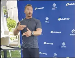  ?? Associated Press ?? Los Angeles Rams coach Sean McVay speaks with reporters outside the team’s training camp headquarte­rs, Friday, in Newport Beach. McVay said the Super Bowl champion Rams are determined to guard against complacenc­y as they begin their quest to become the NFL’s first repeat champions in 18 years.