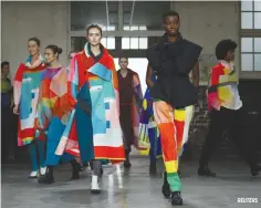  ?? REUTERS ?? ISSEY MIYAKE’s black and white and kaleidosco­pe creations.