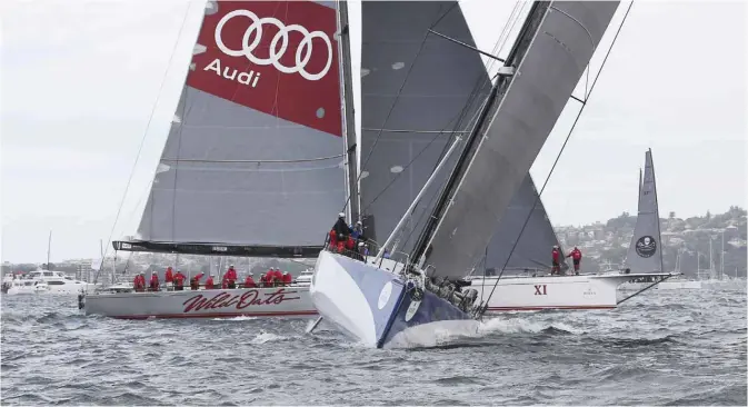  ??  ?? SYDNEY: Ragamuffin 100 sails away from Wild Oats XI during the start of the Sydney Hobart yacht race in Sydney, yesterday. The 628-nautical-mile race started in Sydney Harbour and is expected to end two to three days later in Hobart, the capital of the island state of Tasmania. — AP