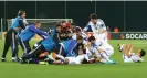  ?? Petras Malūkas/AFP/Getty Images ?? Matteo Vitaioli is mobbed after ending San Marino’s run of 34 away games without a goal in 2015. A stoppage-time winner for Lithuania consigned them to defeat. Photograph: