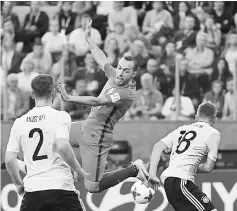  ??  ?? Chile’s midfielder Marcelo Diaz (centre) jumps for the ball against Germany’s defender Joshua Kimmich (right) during the 2017 Confederat­ions Cup final football match between Chile and Germany at the Saint Petersburg Stadium in Saint Petersburg. — AFP photo