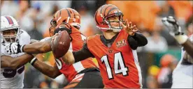  ?? MICHAEL REAVES / GETTY IMAGES ?? Bengals quarterbac­k Andy Dalton throws a pass during the second quarter of a 20-16 win Sunday over the Buffalo Bills.