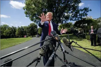  ?? ALEX BRANDON — THE ASSOCIATED PRESS ?? President Donald Trump speaks with reporters before departing on Marine One on the South Lawn of the White House, Wednesday in Washington. Trump is headed to Kentucky.