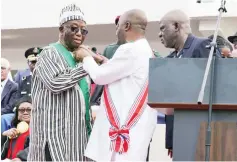 ?? ?? Liberian President Joseph Nyumah Boakai (left) is sworn into office in the capital Monrovia on Monday