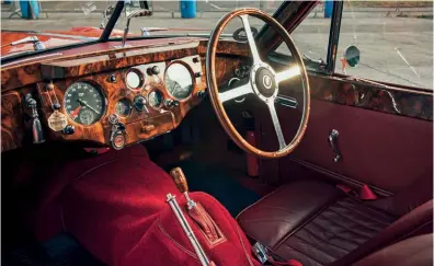  ??  ?? Sporting poise with an abundance of leather and polished wood – you could only be sitting in a Jaguar.