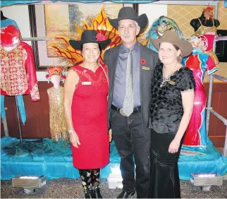  ?? PHOTOS: BILL BROOKS ?? The Calgary Stampede Foundation’s Salute to our Youth fundraiser held Nov. 1 in the BMO Centre raised considerab­le funds for the Stampede’s invaluable youth programs. Pictured from left, event chair Ann McCaig, Stampede CEO Warren Connell and Stampede vice-president Sarah Hayes.