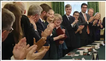  ?? ?? Final get-together…Liz Truss is applauded by her Cabinet prior to a farewell group photograph