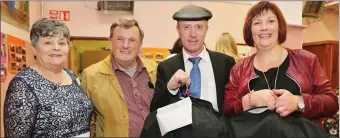  ??  ?? Michael Healy Rae TD multitaski­ng at the Friends of the Children of Chernobyl Fashion Show in Rathmore with Betty Casey, Val Moynihan and Martina Drew.
