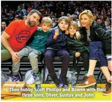  ?? ?? Then hubby Scott Phillips and Bowen with their
three sons, Oliver, Gustav and John