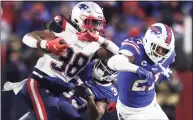  ?? Bryan M. Bennett / Getty Images ?? The Patriots’ Rhamondre Stevenson (38) carries against the Bills on Monday night.