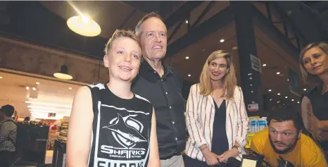  ?? Picture: AAP IMAGE ?? Opposition Leader Bill Shorten with young Cronulla Sharks fan Lincoln at North Lakes Shopping Centre in Brisbane