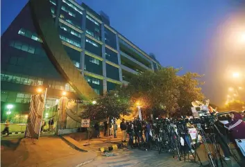  ?? PTI ?? Journalist­s wait outside the CBI Headquarte­rs in New Delhi. The Central Vigilance Commission recommende­d the removal of the CBI’s two most senior officials, a minister said.