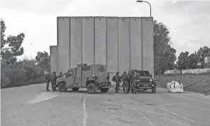  ?? TSAFRIR ABAYOV/AP ?? Israeli soldiers deploy on the Gaza border Wednesday. The Israeli military said a civilian was injured by gunfire from the Gaza Strip.