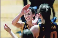  ?? Ronald Cortes / Associated Press ?? Iowa guard Caitlin Clark is congratula­ted as she heads to the bench during the second half of the team’s game against Kentucky in the second round of the NCAA women’s tournament on Tuesday at Greehey Arena in San Antonio.