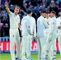  ?? AFP ?? Stuart Broad (left) gestures after overtaking Ian Botham as England’s second highest Test wicket-taker. —
