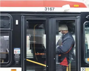  ?? NATHAN DENETTE THE CANADIAN PRESS FILE PHOTO ?? The Toronto Transit Commission and Ottawa’s OC Transpo have announced one-time plans to distribute single-use face coverings as part of efforts to promote their mandatory-mask policies.