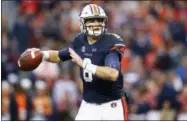  ?? BRYNN ANDERSON — THE ASSOCIATED PRESS ?? Auburn quarterbac­k Jarrett Stidham prepares to throw a pass against Georgia during the first half of an NCAA college football game Saturday in Auburn, Ala. Auburn won 40-17.