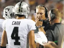  ?? Alex Brandon / Associated Press ?? Raiders QB Derek Carr regressed during a disappoint­ing year that ultimately cost head coach Jack Del Rio his job.