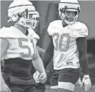  ?? NATHAN J FISH/THE OKLAHOMAN ?? Oklahoma State linebacker­s Collin Oliver (30) and Bo Hardy (51) go through drills in the first practice of spring.