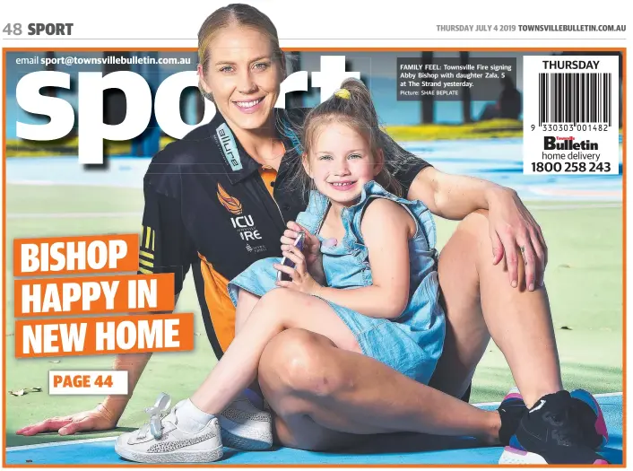  ?? Picture: SHAE BEPLATE ?? FAMILY FEEL: Townsville Fire signing Abby Bishop with daughter Zala, 5 at The Strand yesterday.
