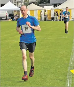  ?? 16_T35_Argyllshir­e Gathering_17 ?? Andrew Campbell- Gray finishes the hill race.