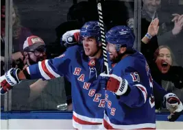  ?? FRANK FRANKLIN II/AP ?? The Rangers’ Will Cuylle (50) celebrates with Blake Wheeler (17) after scoring a goal during the third period on Thursday in New York.