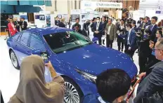  ?? Virendra Saklani/Gulf News ?? The Toyota Mirai, a hydrogen powered fuel cell electric vehicle, drew considerab­le visitor interest on the opening day of ADSW.