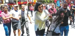  ??  ?? ANKARA: Turkish plaincloth­es police officers detain protesters during a demonstrat­ion in support of two hunger-strikers on July 10, 2017.— AFP