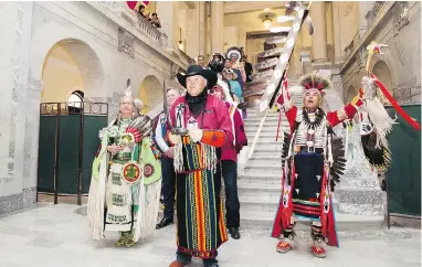  ?? DAVID BLOOM / POSTMEDIA NEWS ?? The Grand Entry Procession makes its way into the Alberta Legislatur­e in Edmonton, where Premier Rachel Notley later apologized to survivors and families of the ’60s Scoop. Alberta is the second province to offer a formal apology — Manitoba did so in...