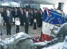  ?? (Kamil Zihnioglu/Reuters) ?? PRIME MINISTER Benjamin Netanyahu and French President Emmanuel Macron pay their respects after laying a wreath at the Vel’ d’Hiv memorial yesterday commemorat­ing the 75th anniversar­y of the roundup of Paris Jews.