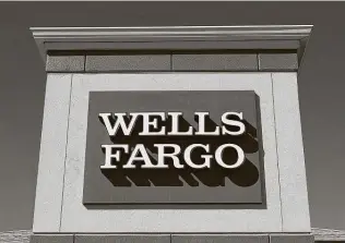  ?? Dreamstime / TNS ?? Wells Fargo is twice accused of threatenin­g to call police on people trying to either withdraw cash from their accounts or trying to cash a $200 check.