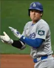  ?? Getty Images ?? Shohei Ohtani reacts after contributi­ng to the Dodgers rally.