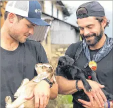  ?? INSTAGRAM @ZACEFRON ?? Zac Efron, right, looks pretty good holding a baby goat.